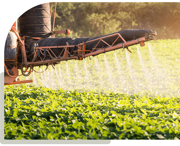 Crop sprayer in action on field